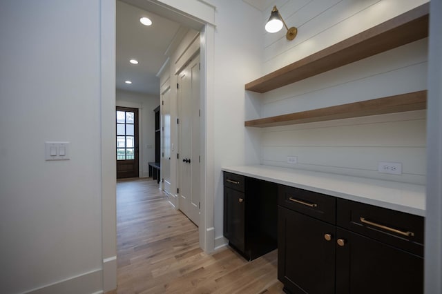 bar with light hardwood / wood-style flooring