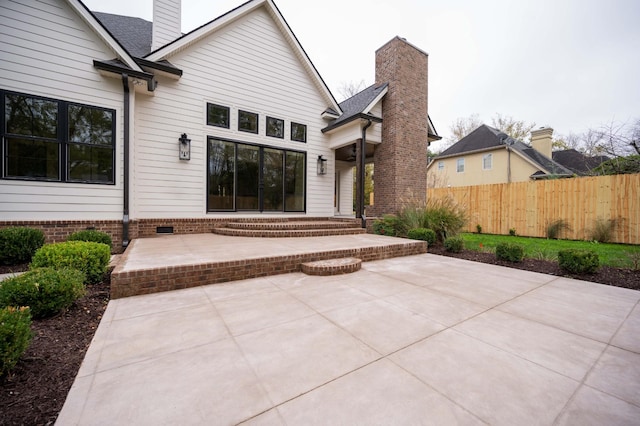 rear view of property featuring a patio area