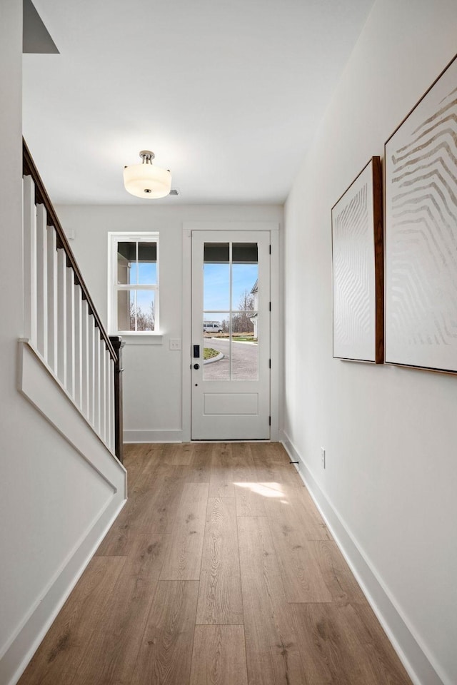 entryway with light wood-type flooring