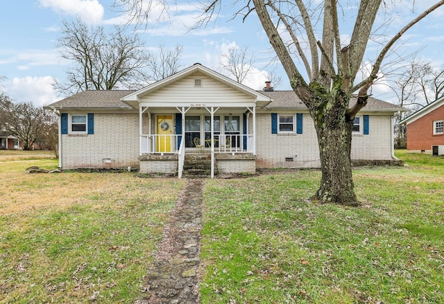 view of front of home featuring central AC unit, covered porch, and a front lawn