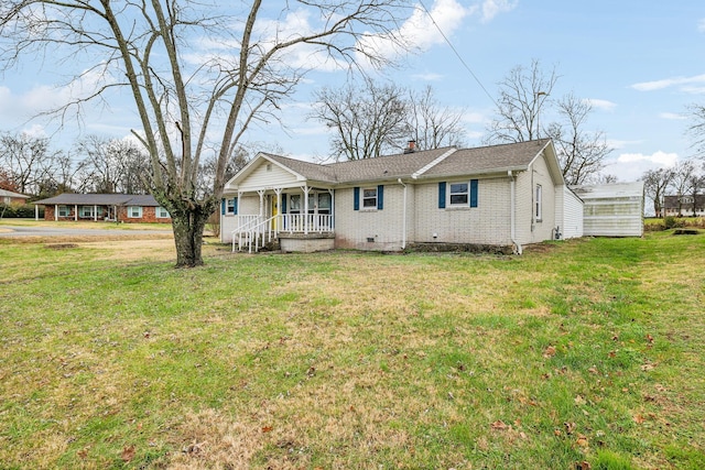 view of front of property featuring covered porch and a front yard