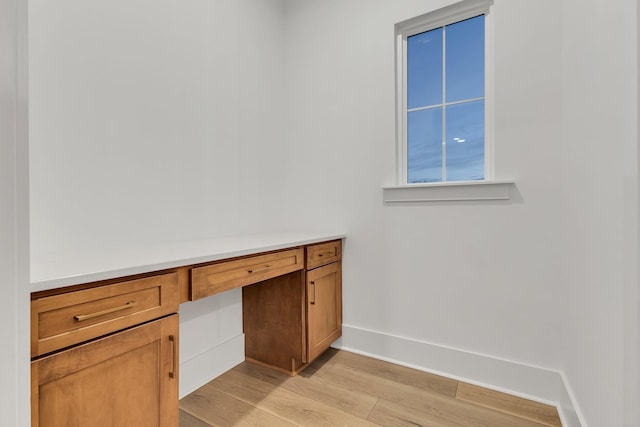 bathroom with hardwood / wood-style flooring