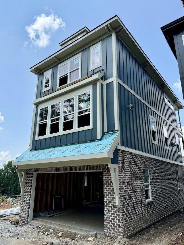 view of side of property with a garage