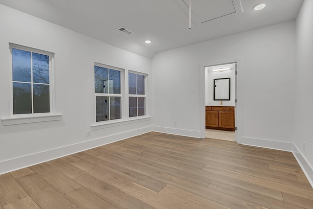 spare room featuring light hardwood / wood-style floors