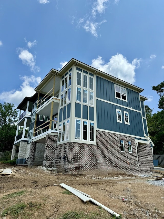 view of side of property with central AC unit