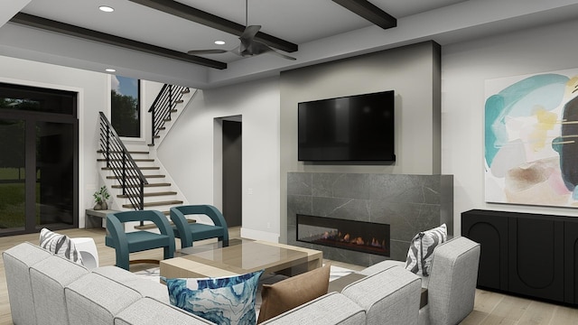 living room with ceiling fan, beam ceiling, light wood-type flooring, and a tile fireplace