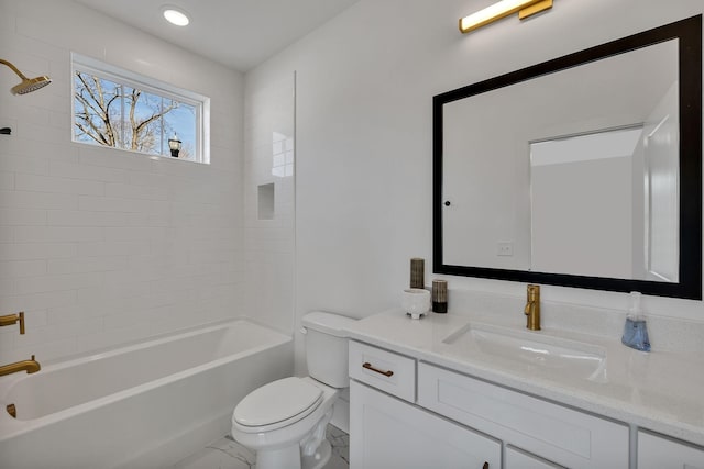 full bathroom with vanity, toilet, and tiled shower / bath combo