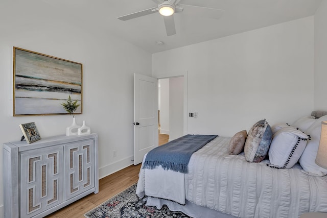 bedroom featuring light hardwood / wood-style floors and ceiling fan