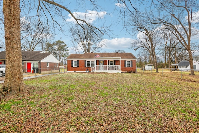 view of front facade with a front lawn and covered porch