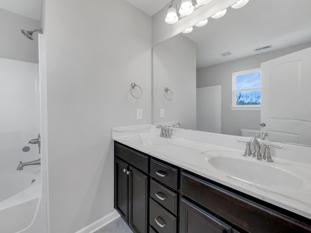 full bathroom with vanity, toilet, and shower / washtub combination