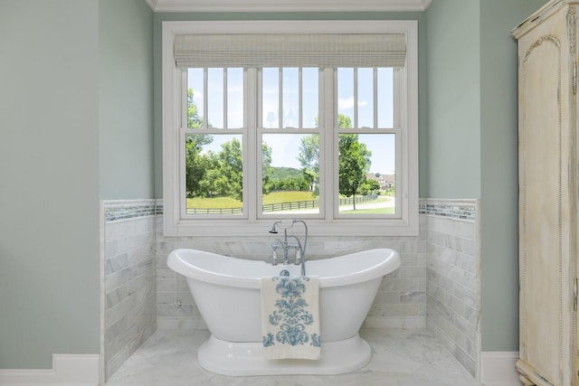 bathroom featuring a bathing tub and tile walls