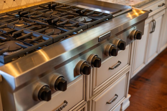 room details with stove and white cabinets