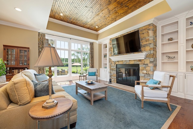 living room with wooden ceiling, a stone fireplace, built in features, dark hardwood / wood-style floors, and ornamental molding