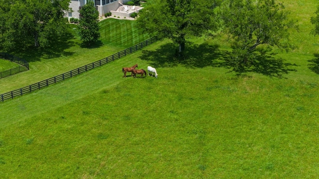 birds eye view of property with a rural view