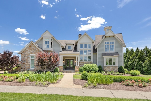 craftsman-style house with french doors