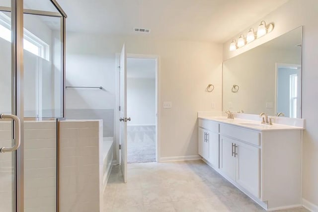 bathroom with shower with separate bathtub and vanity