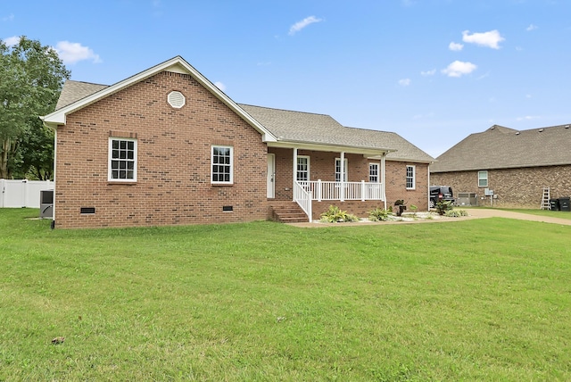 view of front of house featuring covered porch and a front lawn