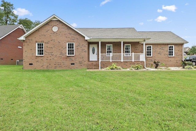 single story home with covered porch and a front yard