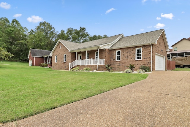 ranch-style house with covered porch and a front yard