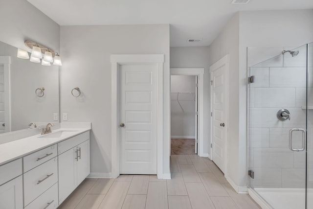 bathroom with vanity and walk in shower