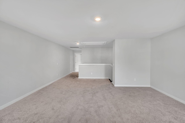 basement featuring light colored carpet