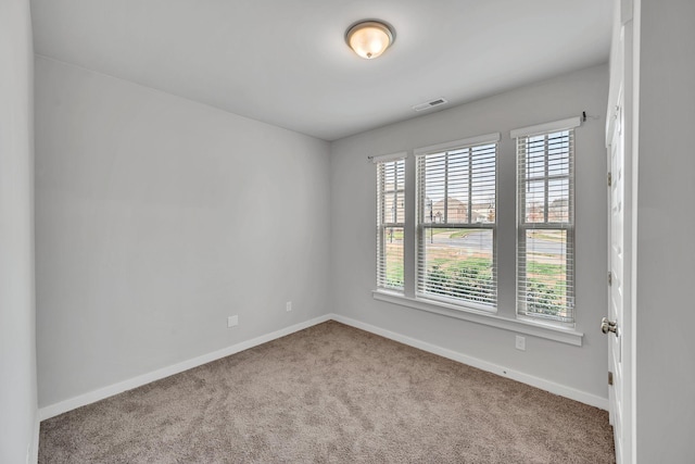 empty room featuring light carpet