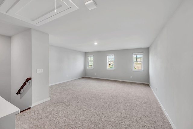 carpeted empty room featuring a wealth of natural light