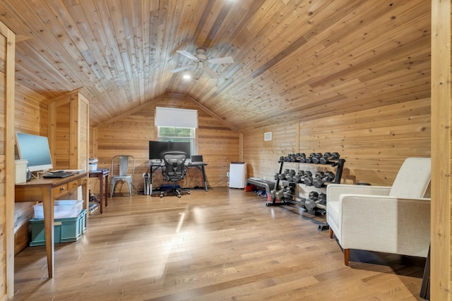 interior space featuring ceiling fan, light hardwood / wood-style floors, lofted ceiling, wooden walls, and wood ceiling