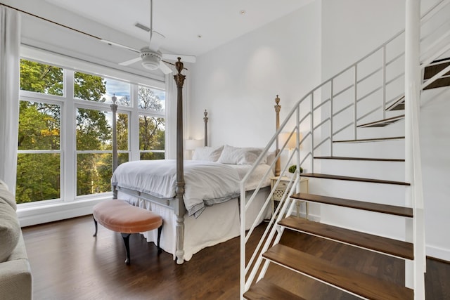 bedroom featuring ceiling fan and dark hardwood / wood-style flooring