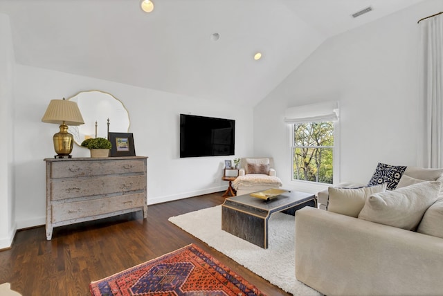 living room featuring dark hardwood / wood-style floors and lofted ceiling