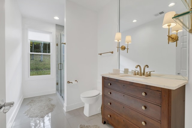 bathroom featuring toilet, vanity, tile patterned floors, and walk in shower