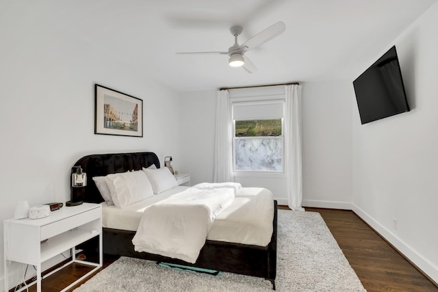 bedroom with ceiling fan and dark wood-type flooring