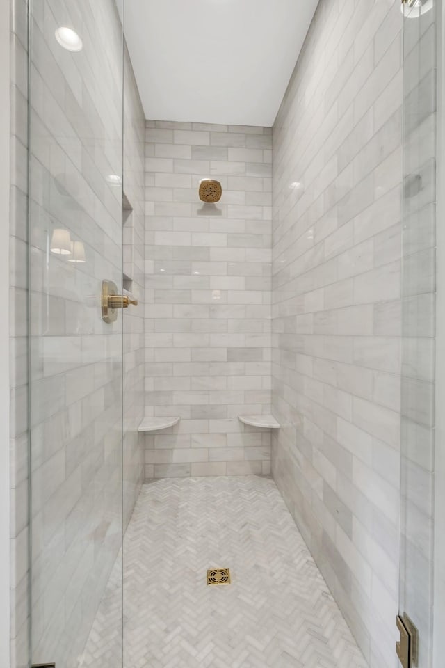 bathroom with a shower with shower door