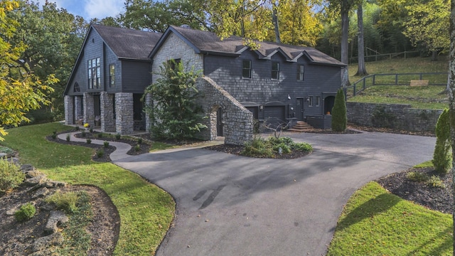 view of front of home with a garage and a front yard