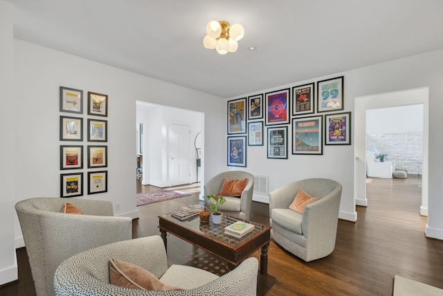 living area with dark hardwood / wood-style floors