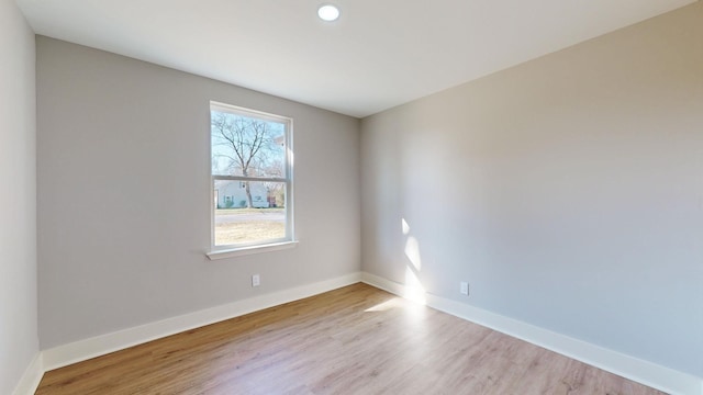 unfurnished room with light hardwood / wood-style floors