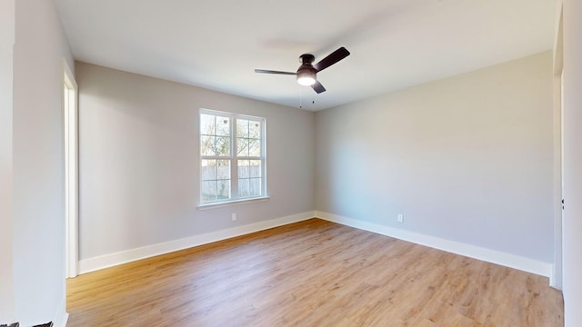 unfurnished room featuring ceiling fan and light wood-type flooring