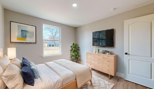 bedroom with light wood-type flooring