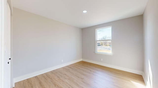 spare room featuring light wood-type flooring