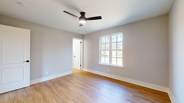 interior space with light wood-type flooring and ceiling fan