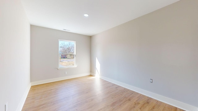 spare room featuring light wood-type flooring