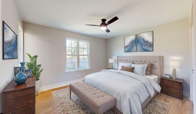 bedroom featuring light hardwood / wood-style floors and ceiling fan