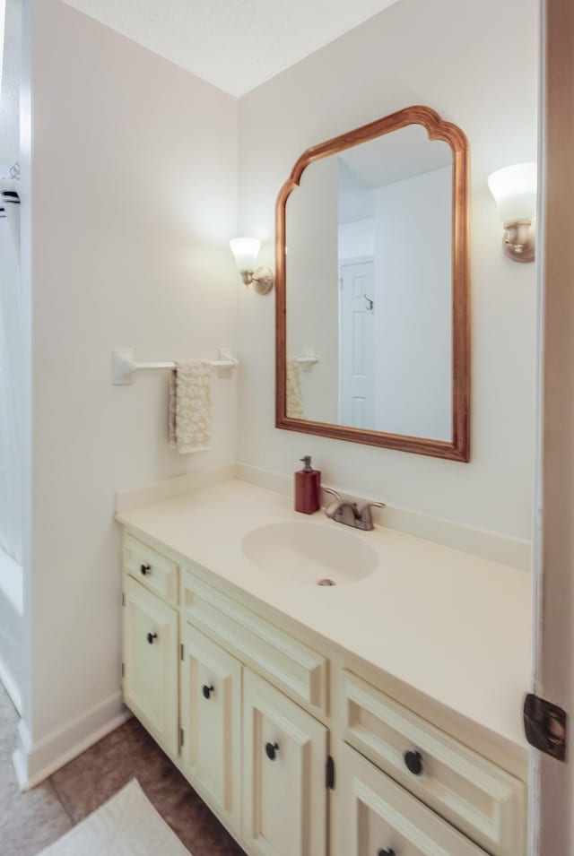 bathroom with vanity and tile patterned floors