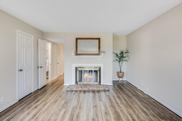 unfurnished living room featuring light wood-type flooring