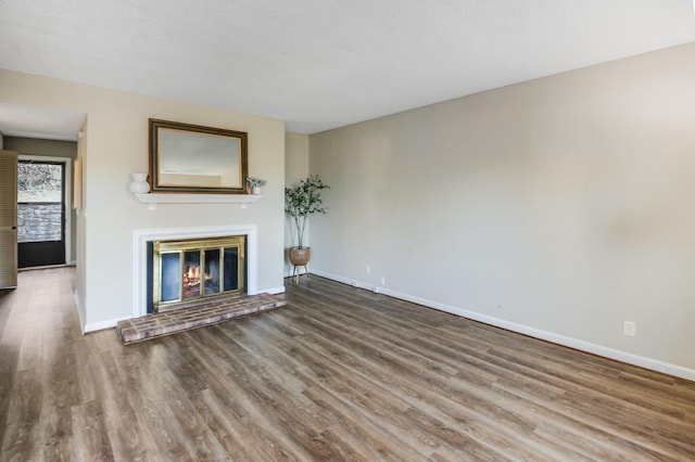 unfurnished living room with hardwood / wood-style flooring