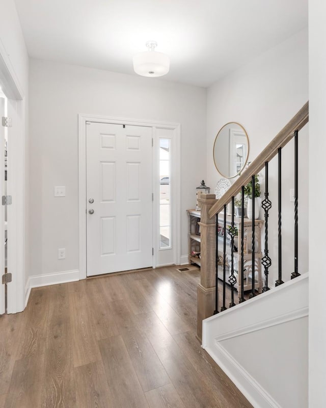 foyer entrance featuring hardwood / wood-style flooring