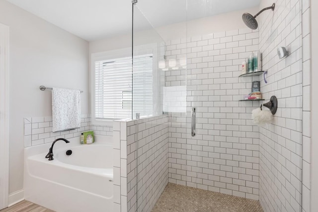 bathroom with shower with separate bathtub