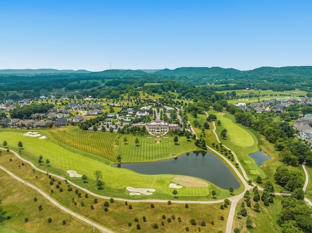 birds eye view of property featuring a water and mountain view