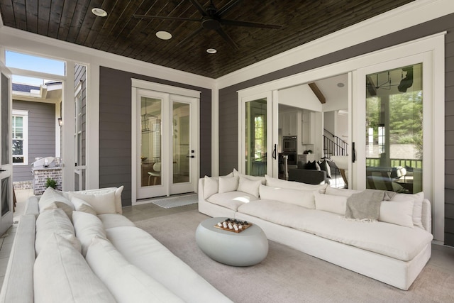 view of patio / terrace featuring ceiling fan and french doors