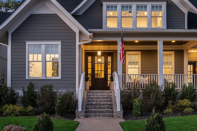 property entrance featuring covered porch